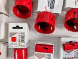 many different types of hole saws on the table