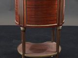 an antique mahogany and brass side table