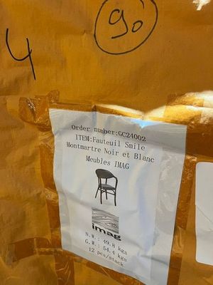 a piece of paper taped to a wall with a picture of a chair on it