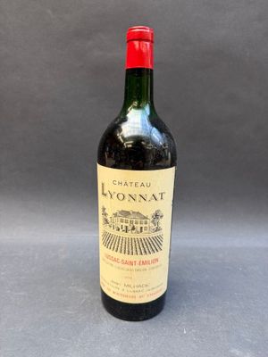 a close up of a bottle of wine on a table