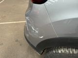 a close up of a car that has been dented