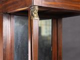 a wooden display case with a mirror on top of it