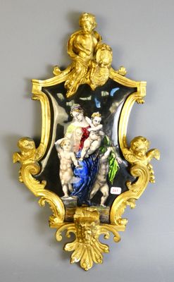 a gold frame with a picture of a woman and a cat on it