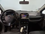 the interior of a small car with a steering wheel and dashboard