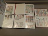 a lot of stamps on the pages of a book