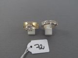 two gold rings and a diamond ring with a price tag on a table