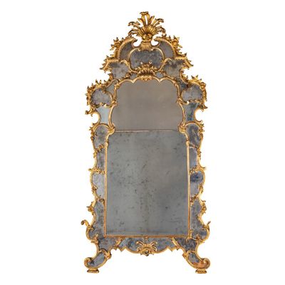 une image représentant un miroir bleu et doré sur fond blanc