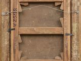 an old wooden picture frame with a picture of a cat in it