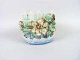 a small vase with flowers in it sitting on a table