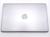 hp laptop computer sitting on a white surface with a logo on the screen