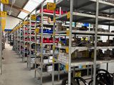 many shelves with various items in them in a warehouse