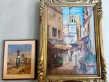 a picture of a painting hanging on a wall next to a picture of a man