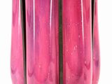 purple glass vase with a black metal handle on a white background