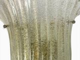 a glass vase that is sitting on a table