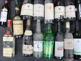 many bottles of wine and liquor on the table