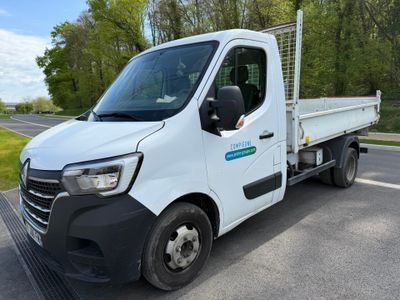 a white truck that is parked on the side of the road