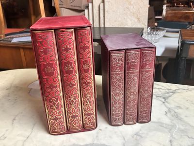 three books sitting on a table next to each other