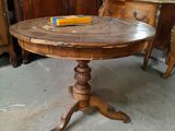a wooden table with a book on it in a room