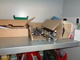 a box of tools on a shelf next to a pair of scissors