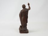 statue of a man with a raised hand on a white background