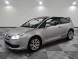 a picture of a silver citrole parked on a checkered floor