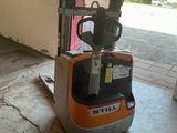 a forklift that is parked in a garage