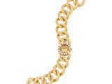 a close up of a gold bracelet on a white background