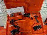a close up of an orange tool box with tools inside of it