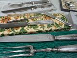 a table with a bunch of silverware on it