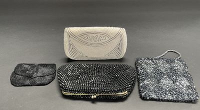 three pieces of purses are sitting on a table next to each other