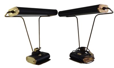 pair of black and gold desk lamps on metal legs