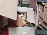 many boxes of papers and other items in a room