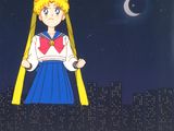 sailor girl standing in front of a city at night with the moon in the background