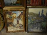 two framed pictures of a house and a boat