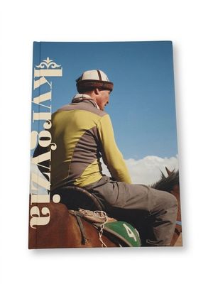 a book with a picture of a man sitting on a horse