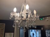 a chandelier hanging from the ceiling in a room