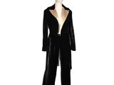 a mannequin wearing a black suit with gold trimmings