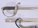 two swords and a chain on a white surface