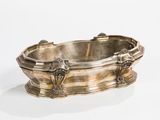 a silver bathtub that is sitting on a white surface