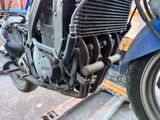 a close up of a motorcycle with a radiator on the back of it