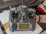 a radio sitting on top of a stack of books