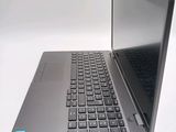 a laptop that is open on a white surface