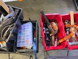 two boxes with tools in them sitting on the floor