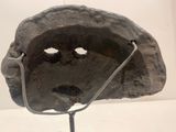 a rock with a face on it and a stethoscope in front of it