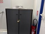 a black cabinet in the corner of a room