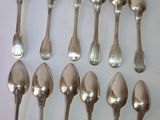 a lot of spoons that are sitting on a table