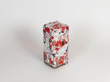 an image of a red and white vase sitting on top of a white surface