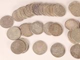 a lot of coins that are on the table