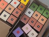 a lot of boxes with different colored cards in them
