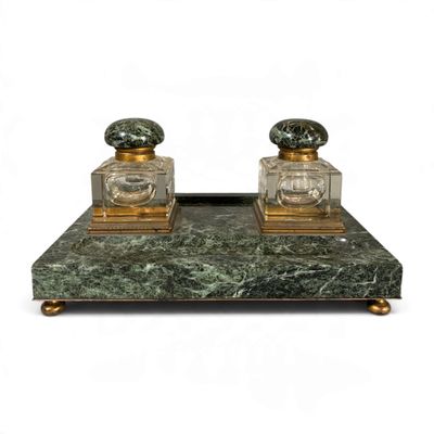 pair of green marble and brass perfume bottles on a stand